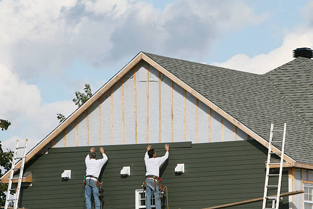Professional Siding technician working in Madison, MD
